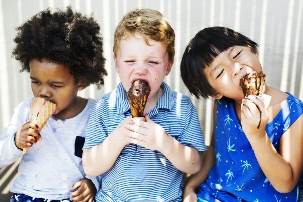 Children enjoying ice cream on a summer day